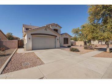 Two-story house with a large garage and well-manicured front yard at 8912 S 40Th Dr, Laveen, AZ 85339
