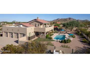 Spacious home with a large pool and desert landscaping at 8945 N Cordoniz Ln, Casa Grande, AZ 85194