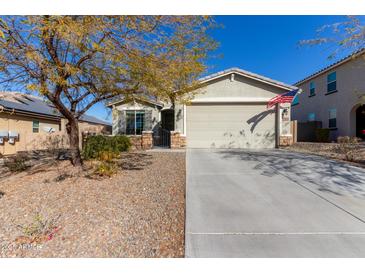 One-story house with a two-car garage and landscaped front yard at 10815 S 175Th Dr, Goodyear, AZ 85338