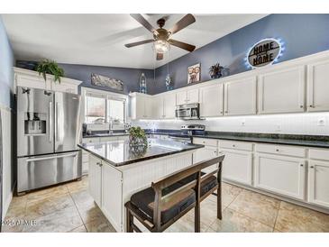 Spacious kitchen with stainless steel appliances and granite countertops at 11268 E Poinsettia Dr, Scottsdale, AZ 85259