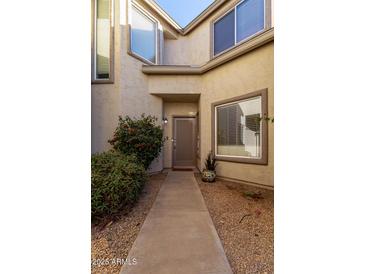 Inviting front entry with a well-maintained walkway at 4301 N 21St St # 24, Phoenix, AZ 85016