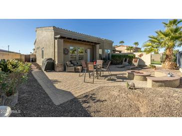Private backyard oasis with patio, fire pit, and plenty of space to relax at 6202 E Mckellips Rd # 91, Mesa, AZ 85215
