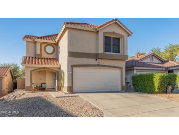 Charming two-story home with a terracotta roof and well-maintained front yard at 18611 N 22Nd St # 2, Phoenix, AZ 85024