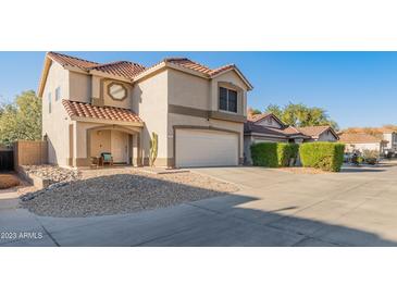 Two-story house with a two-car garage and desert landscaping at 18611 N 22Nd St # 2, Phoenix, AZ 85024