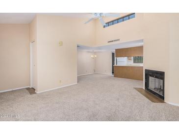 Spacious living room features a fireplace and high ceilings at 2020 W Union Hills Dr # 201, Phoenix, AZ 85027