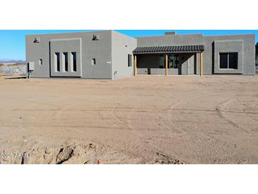 Gray stucco home with covered patio and large backyard at 24207 N 194Th Ave, Surprise, AZ 85387