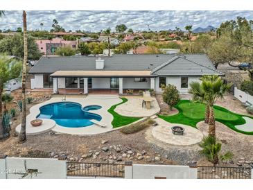Luxury home with private pool and putting green; desirable location at 10241 N Nicklaus Dr, Fountain Hills, AZ 85268