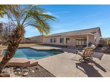 Relaxing backyard oasis with a sparkling pool and patio at 1102 E Bartlett Way, Chandler, AZ 85249