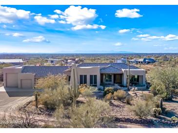 Aerial view of a stunning, single-story home with desert landscaping at 148 N La Barge Rd, Apache Junction, AZ 85119