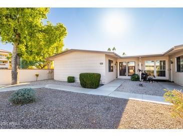 Attractive exterior of condo with well-maintained landscaping and walkway at 10254 W Palmeras Dr, Sun City, AZ 85373