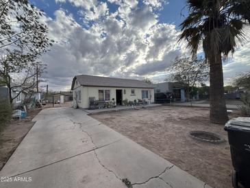 Cute bungalow with front yard and driveway at 1725 W Hadley W St, Phoenix, AZ 85007