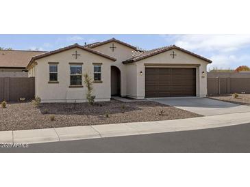 Charming single-story home showcasing a two car garage and low maintenance desert landscaping at 2937 E Lawndale Ct, Gilbert, AZ 85298