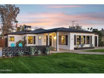 Charming single-story home with a well-manicured lawn and modern updates at 3317 N 17Th Ave, Phoenix, AZ 85015