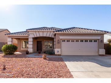 One-story house with tan exterior, tile roof, and a two-car garage at 4233 E Colonial Dr, Chandler, AZ 85249