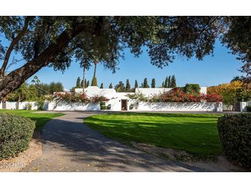 Stunning Spanish-style home with lush landscaping and a long driveway at 6617 N Central Ave, Phoenix, AZ 85012