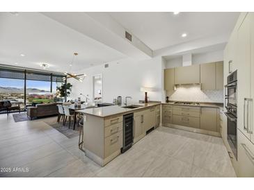 Modern kitchen with stainless steel appliances and an island at 7180 E Kierland Blvd # 1209, Scottsdale, AZ 85254