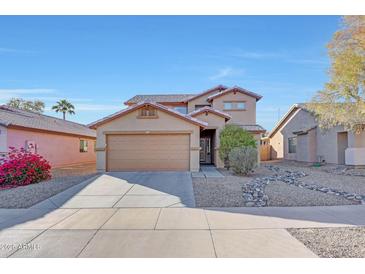 Two-story house with a two-car garage and landscaped front yard at 1976 S 172Nd Ln, Goodyear, AZ 85338