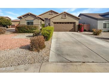One-story house with a two-car garage and well-maintained landscaping at 3305 S 122Nd Ln, Tolleson, AZ 85353