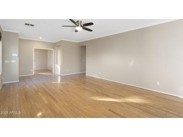 Bright living room with hardwood floors and ceiling fan at 8903 N 57Th Dr, Glendale, AZ 85302