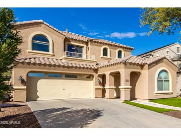Charming two-story home features a private balcony and a two car garage on a sunny day at 2838 E Shady Spring Trl, Phoenix, AZ 85024