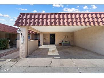 Covered carport with space for one vehicle and extra storage at 5228 N 15Th Dr, Phoenix, AZ 85015