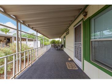 Covered patio with table and chairs, overlooking the backyard at 11596 W Sierra Dawn Blvd # 357, Surprise, AZ 85378