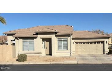 Single-story home with attached garage and neutral color scheme at 1314 E Thompson Way, Chandler, AZ 85286