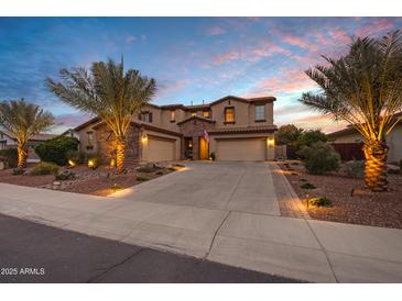 Two-story home with a three-car garage and palm trees at 3457 E Virgil Dr, Gilbert, AZ 85298