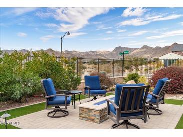 Backyard patio with fire pit and mountain views at 4892 N 205Th Dr, Buckeye, AZ 85396