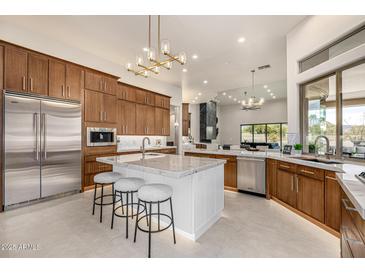 Spacious kitchen with island, stainless steel appliances, and ample cabinetry at 9655 N 130Th St, Scottsdale, AZ 85259