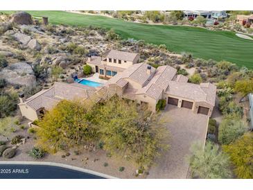 Luxury home with pool, expansive driveway, and stunning desert landscape views at 10712 E Greythorn Dr, Scottsdale, AZ 85262