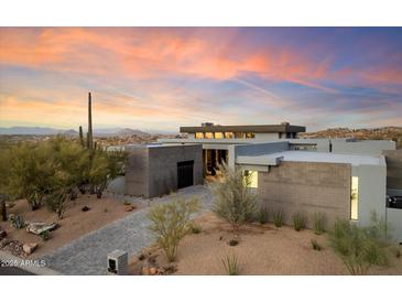 Stunning contemporary home with mountain views and a desert landscape at 11952 E Casitas Del Rio Dr, Scottsdale, AZ 85255