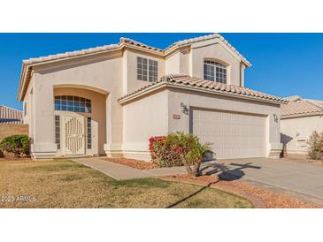 Two-story house with a two-car garage and well-maintained lawn at 1220 W Gail Ct, Chandler, AZ 85224