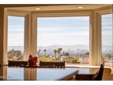 Bright dining area with large windows offering stunning city views at 2235 E Vista Ave, Phoenix, AZ 85020