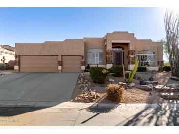 Beautiful desert home with a two-car garage and nicely landscaped yard at 24029 N 76Th Pl, Scottsdale, AZ 85255