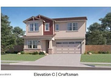 Two-story Craftsman home with a red accented front and a two-car garage at 3344 S Channing Cir, Mesa, AZ 85212