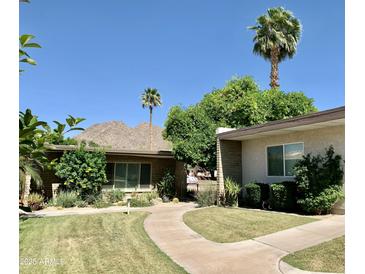 Mid-century modern home with landscaped yard and mountain views at 4800 N 68Th St # 349, Scottsdale, AZ 85251