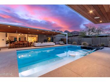 Stunning pool and patio with mountain views; home interior partially visible at 5818 N 45Th St, Phoenix, AZ 85018