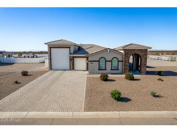 Single-story home with a large garage and landscaped front yard at 6608 N Cima Vista Dr, Casa Grande, AZ 85194