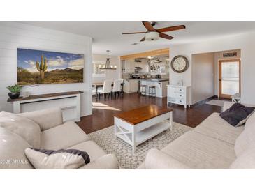 Open living room with adjacent kitchen and dining area at 6627 N 16Th Dr, Phoenix, AZ 85015