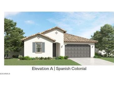 Spanish Colonial style home with gray garage door and landscaping at 8058 E Petra Ave, Mesa, AZ 85212