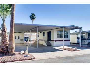 Mobile home with carport and landscaping at 17200 W Bell Rd # 387, Surprise, AZ 85374