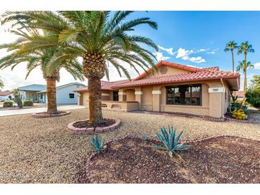 Single-story home with desert landscaping and a red tile roof at 19606 N Trail Ridge Dr, Sun City West, AZ 85375