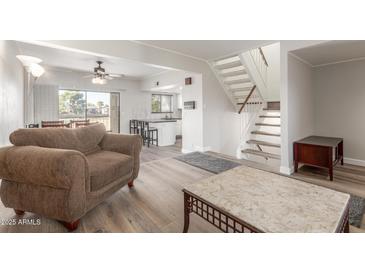 Bright living room with hardwood floors and comfortable seating at 2524 S El Paradiso -- # 76, Mesa, AZ 85202