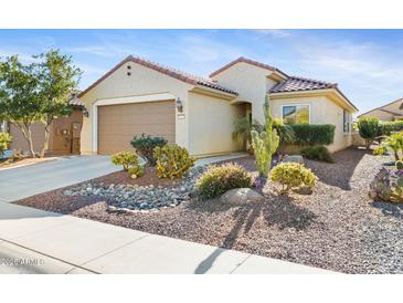 Single-story home with desert landscaping and two-car garage at 26171 W Via Del Sol Dr, Buckeye, AZ 85396