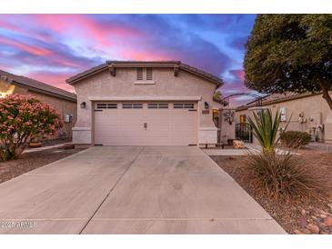 Single-story home with two-car garage and landscaped front yard at 26222 W Behrend Dr, Buckeye, AZ 85396