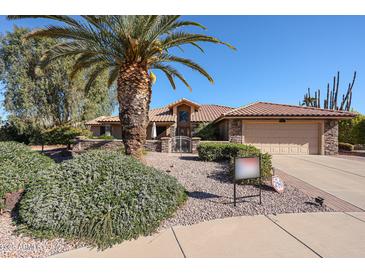 Single story home with desert landscaping and a two-car garage at 2747 Leisure World --, Mesa, AZ 85206