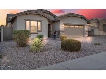 One-story home with a two-car garage, landscaping, and neutral color palette at 28210 N Gedona Way, San Tan Valley, AZ 85143