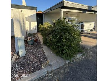 Covered carport with parking space and landscaping at 2835 N 49Th St, Phoenix, AZ 85008