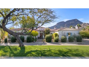 Stunning Spanish-style home with manicured landscaping and mountain views at 5989 E Sapphire Ln, Paradise Valley, AZ 85253